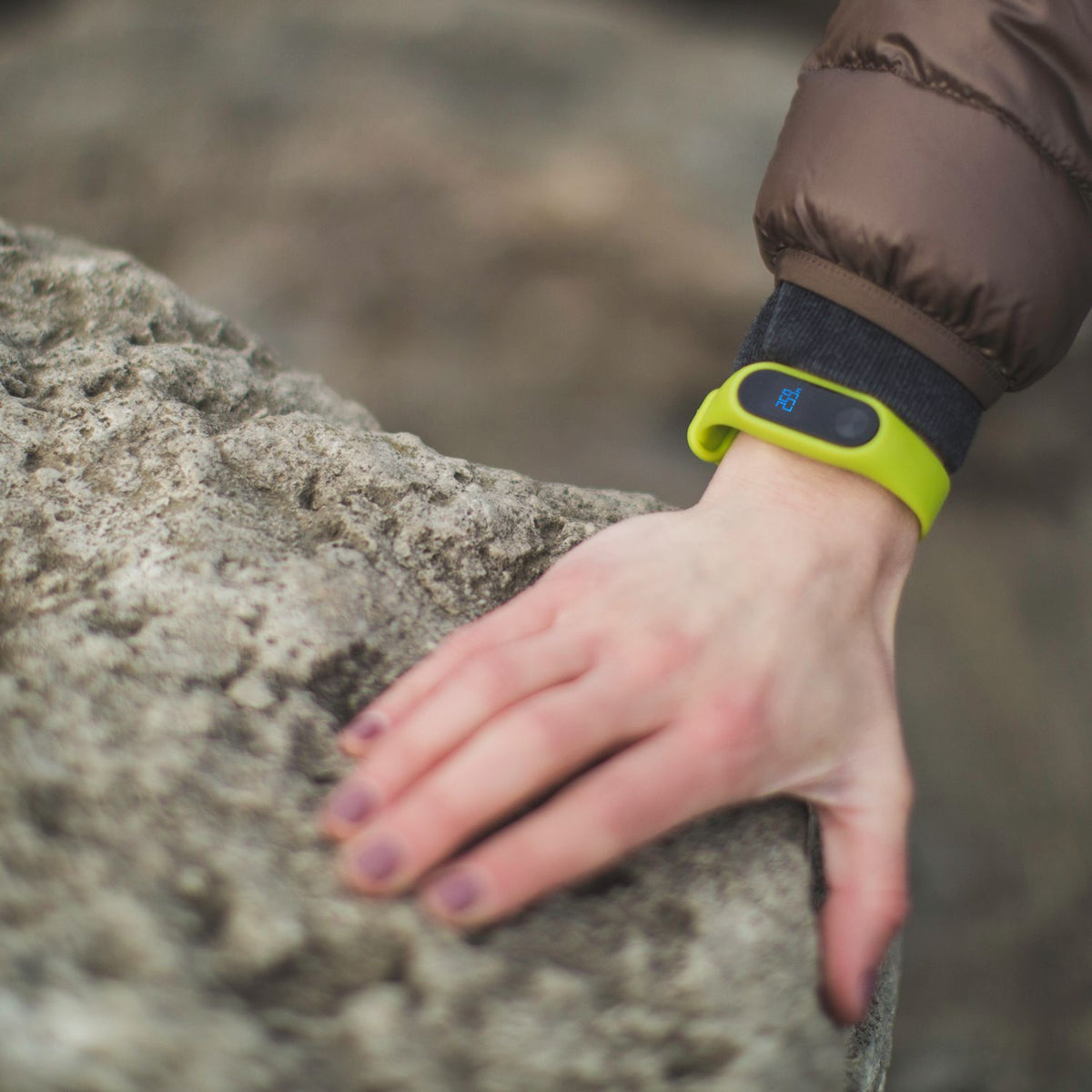 Person wearing a fitness band outdoors