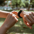 Woman checking information on her fitness band