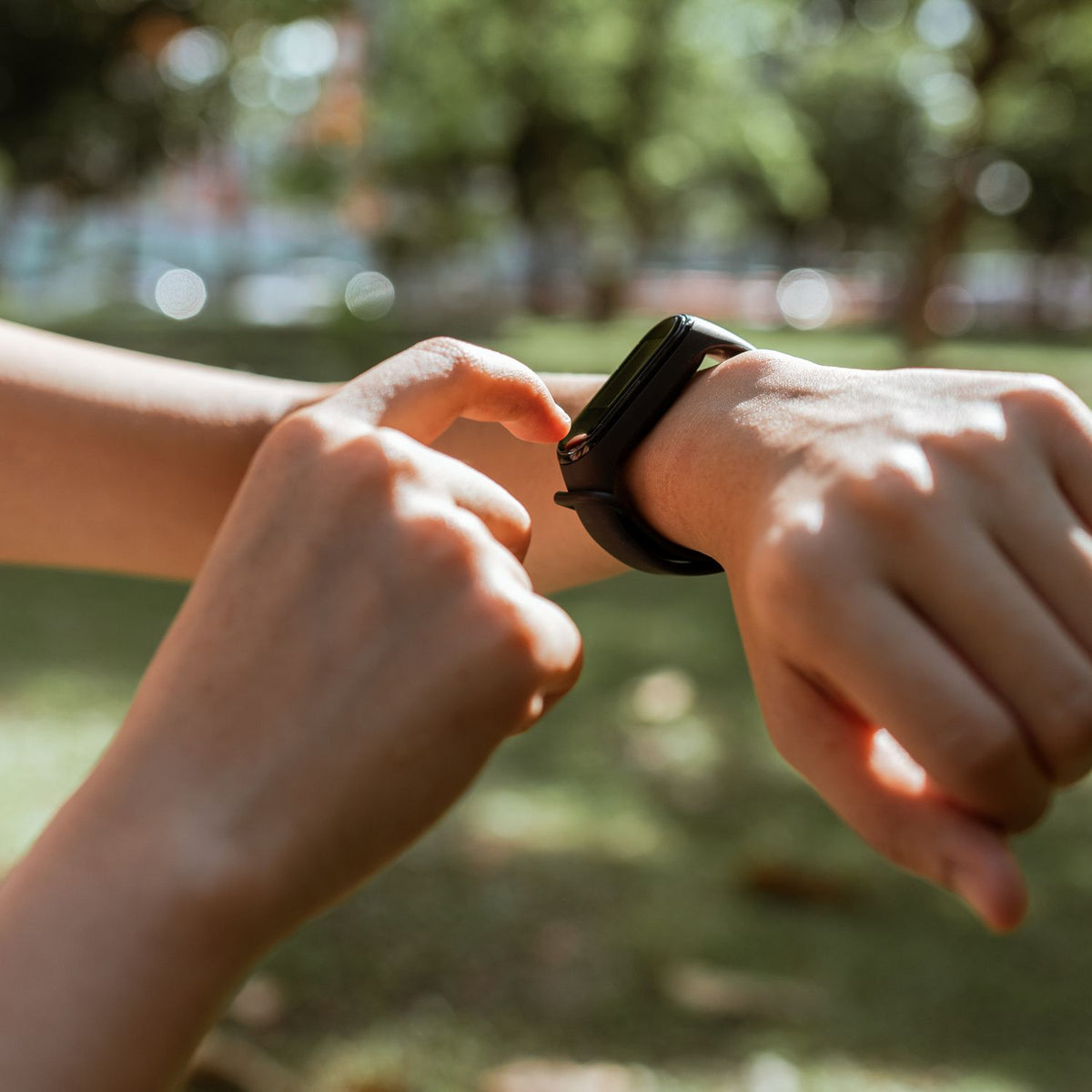 Woman checking information on her fitness band