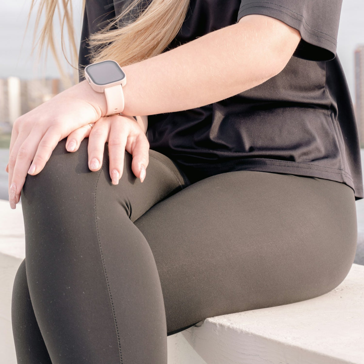 Woman wearing a fitness tracker outdoors